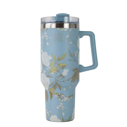 Hoge, lichtblauwe theebeker met handvat, witte en groene bloemenprint, dubbelwandig, doorzichtig deksel en rvs rand.